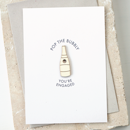 'Pop the Bubbly, You're Engaged' Card with Wooden Champagne Charm